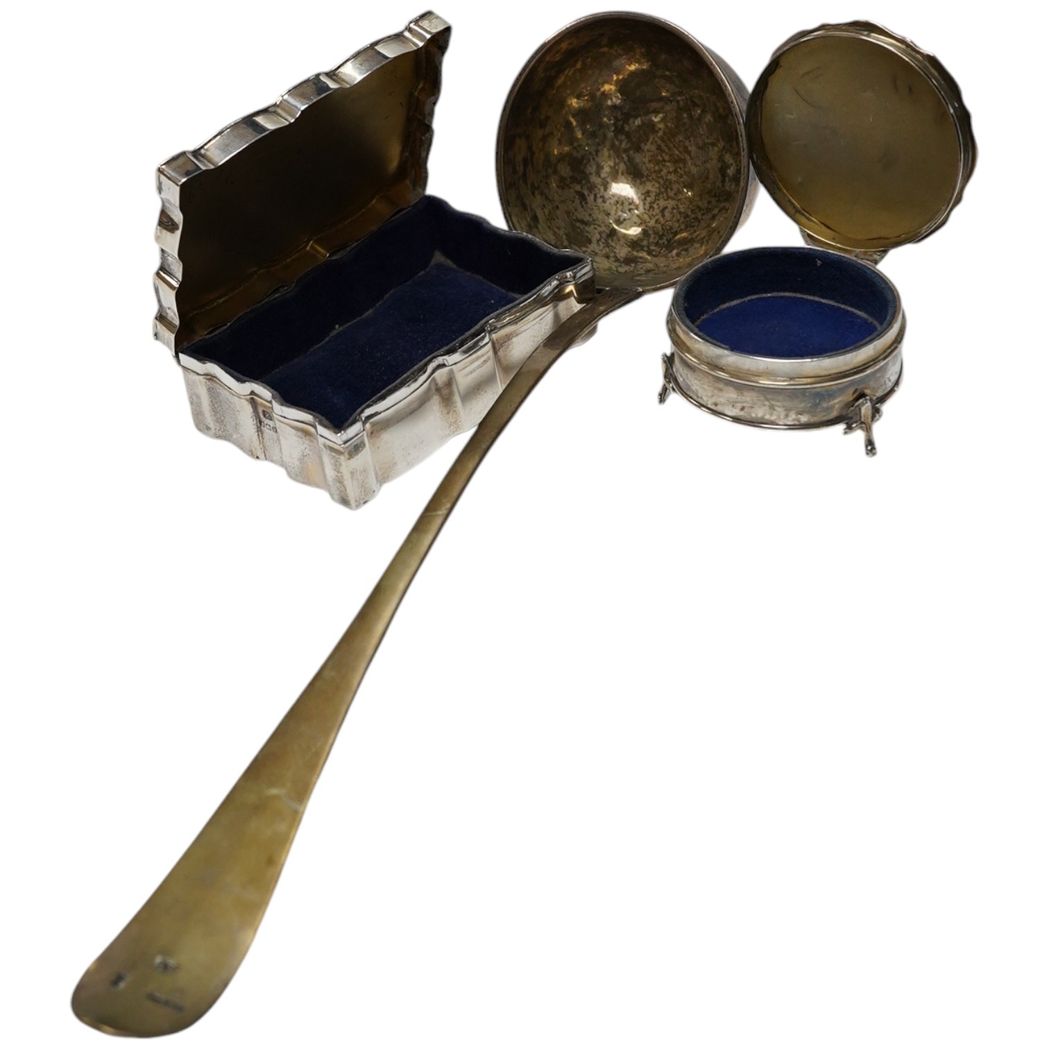 Two George V silver mounted trinket boxes, including rectangular by A & J Zimmerman & Co, 10.7cm, together with a white metal soup ladle. Condition - poor to fair